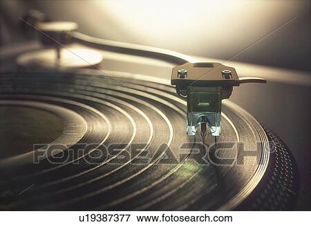 Stock Photo - Vinyl record being played, illustration. Fotosearch