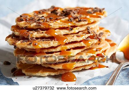 Waffle crisps with dark chocolate and caramel sauce View Large Photo Image Stock Image - Waffle crisps with dark chocolate and caramel sauce. Fotosearch