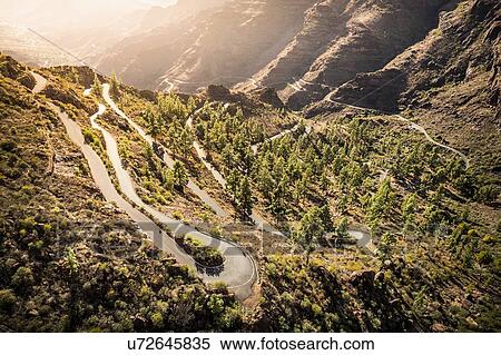 Winding mountain road (GC-605) from Mogn into mountains. South west coast of Gran Canaria, Mogan, Canary Islands, Spain View Large Photo Image Stock Photography - Winding mountain road (GC-605) from Mogn into mountains. South west coast of Gran Canaria, Mogan, Canary Islands, Spain. Fotosearch