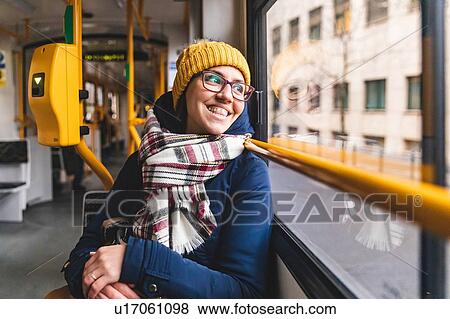 Stock Photo - Woman commuting in tram, Budapest, Hungary. Fotosearch