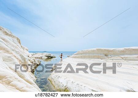 Woman enjoying seaside, Punta Bianca National Reserve, Agrigento, Sicily, Italy View Large Photo Image Stock Photo - Woman enjoying seaside, Punta Bianca National Reserve, Agrigento, Sicily, Italy. Fotosearch