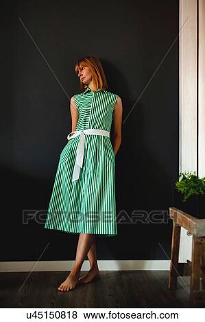 Stock Photo - Woman in green summer dress. Fotosearch