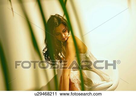 Woman in summer dress sitting chair View Large Photo Image Stock Image - Woman in summer dress sitting chair. Fotosearch