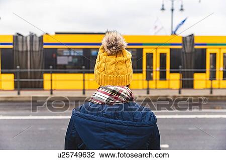 Woman looking at tram passing by, Budapest, Hungary View Large Photo Image Stock Image - Woman looking at tram passing by, Budapest, Hungary. Fotosearch