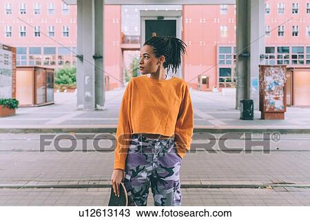 Woman waiting by tram tracks, Milan, Italy View Large Photo Image Stock Image - Woman waiting by tram tracks, Milan, Italy. Fotosearch