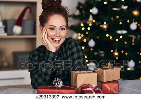 Stock Photo - Woman with Christmas presents. Fotosearch
