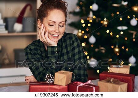 Woman with Christmas presents View Large Photo Image Stock Photography - Woman with Christmas presents. Fotosearch