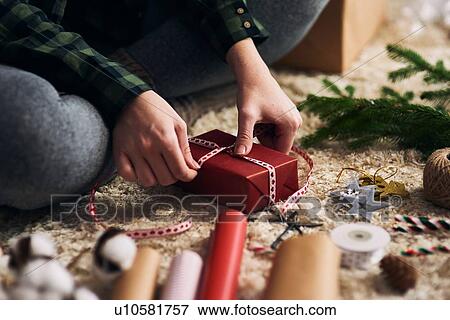 Woman wrapping Christmas presents View Large Photo Image Stock Photo - Woman wrapping Christmas presents. Fotosearch