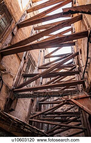 Wooden beams between and supporting buildings, low angle view, Fes, Morocco View Large Photo Image Stock Image - Wooden beams between and supporting buildings, low angle view, Fes, Morocco. Fotosearch