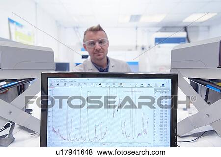Worker inspecting samples in laboratory in recycling factory View Large Photo Image Stock Photo - Worker inspecting samples in laboratory in recycling factory. Fotosearch