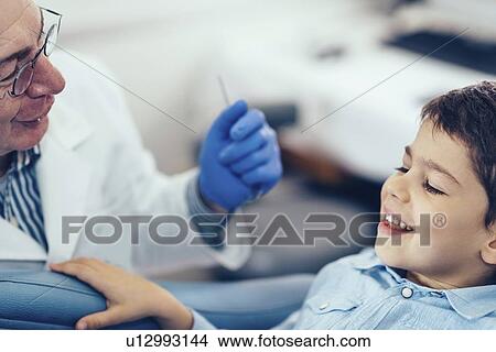 Picture - Young boy having dental check-up. Fotosearch