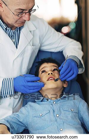 Young boy having dental check-up View Large Photo Image Stock Image - Young boy having dental check-up. Fotosearch