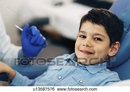 Stock Photograph - Young boy having dental check-up. Fotosearch