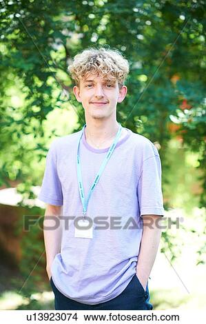 Picture - Young male higher education student on college campus, portrait. Fotosearch