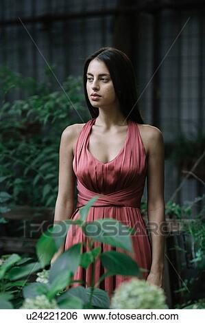 Stock Photograph - Young woman deep in thoughts. Fotosearch
