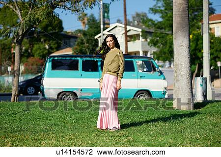 Young woman in maxi skirt in park, portrait, Los Angeles, California, USA View Large Photo Image Stock Image - Young woman in maxi skirt in park, portrait, Los Angeles, California, USA. Fotosearch