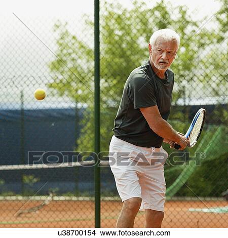 Active senior man playing tennis View Large Photo Image Picture - Active senior man playing tennis. Fotosearch