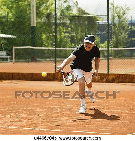Active senior man playing tennis View Large Photo Image Stock Photography - Active senior man playing tennis. Fotosearch