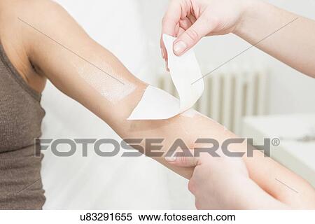 Stock Photography - Arm waxing. Fotosearch