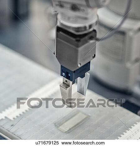 Stock Photography - Articulated robotic arm. Fotosearch
