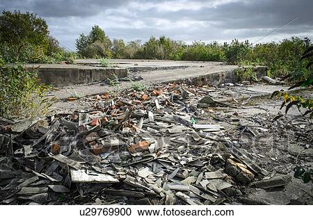 Asbestos on brownfield land View Large Photo Image Stock Image - Asbestos on brownfield land. Fotosearch