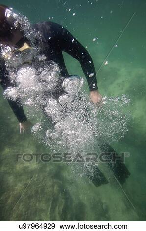 Stock Photo - Ascending free diver. Fotosearch