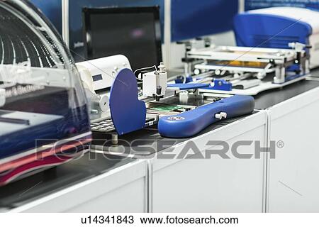 Stock Image - Assembling equipment. Fotosearch