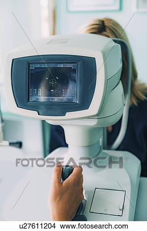 Auto refractometer eye examination View Large Photo Image Picture - Auto refractometer eye examination. Fotosearch