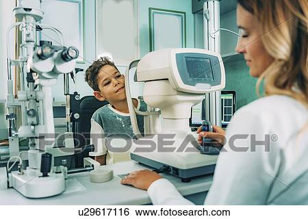 Auto refractometer eye examination View Large Photo Image Stock Photograph - Auto refractometer eye examination. Fotosearch