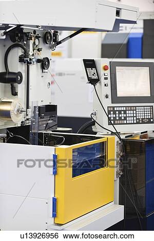 Automated metal cutting machine View Large Photo Image Stock Photograph - Automated metal cutting machine. Fotosearch
