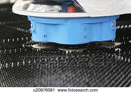 Stock Image - Automated metalwork machine. Fotosearch