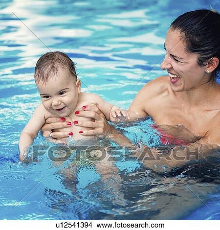 Picture - Baby boy and mother in swimming pool. Fotosearch