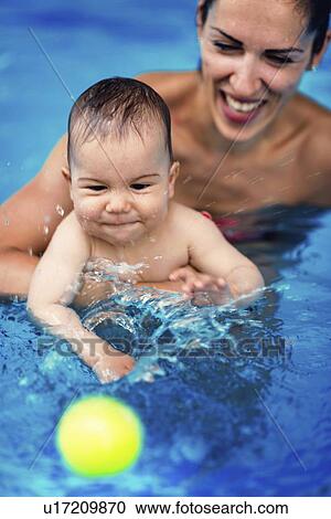 Baby boy and mother in swimming pool View Large Photo Image Stock Image - Baby boy and mother in swimming pool. Fotosearch