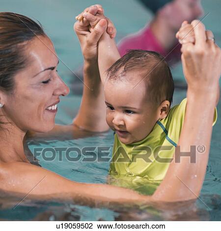 Baby boy and mother in swimming pool View Large Photo Image Stock Image - Baby boy and mother in swimming pool. Fotosearch