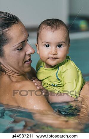 Baby boy and mother in swimming pool View Large Photo Image Stock Image - Baby boy and mother in swimming pool. Fotosearch