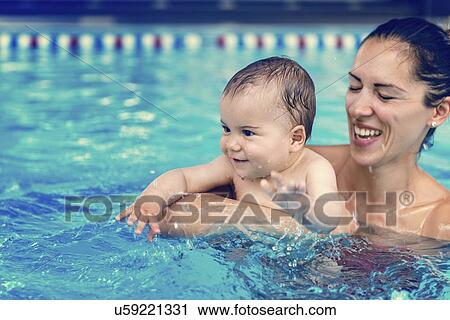 Baby boy and mother in swimming pool View Large Photo Image Stock Image - Baby boy and mother in swimming pool. Fotosearch