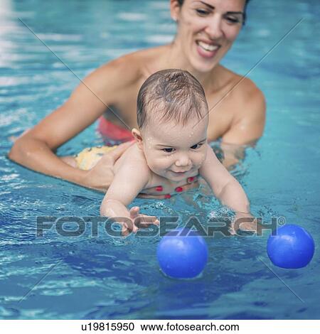 Baby boy swimming View Large Photo Image Stock Image - Baby boy swimming. Fotosearch