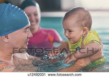 Baby swimming lesson View Large Photo Image Stock Image - Baby swimming lesson. Fotosearch