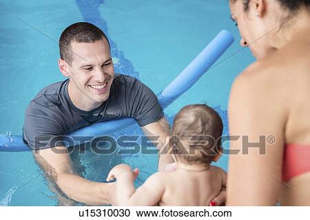 Baby swimming lesson View Large Photo Image Stock Image - Baby swimming lesson. Fotosearch