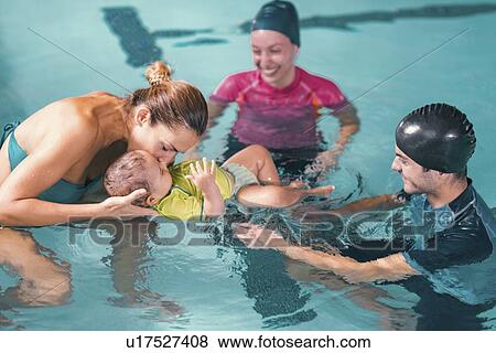 Baby swimming lesson View Large Photo Image Stock Photo - Baby swimming lesson. Fotosearch
