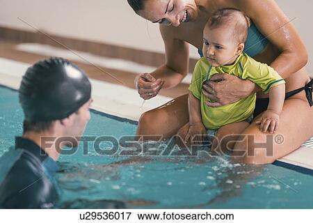 Baby swimming lesson View Large Photo Image Stock Photo - Baby swimming lesson. Fotosearch
