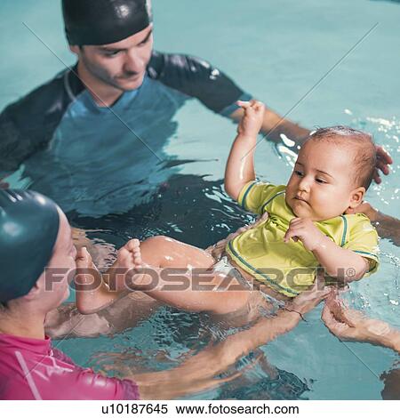 Baby swimming lesson View Large Photo Image Stock Photography - Baby swimming lesson. Fotosearch
