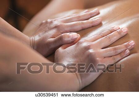 Stock Image - Back massage. Fotosearch
