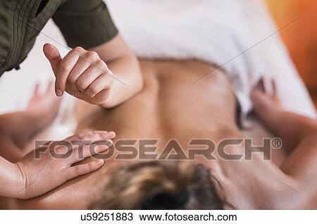 Stock Image - Back massage. Fotosearch