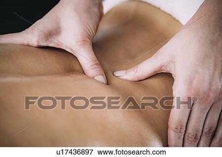 Back massage View Large Photo Image Stock Photo - Back massage. Fotosearch