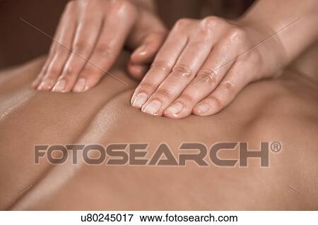 Back massage View Large Photo Image Stock Photo - Back massage. Fotosearch