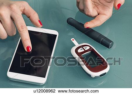 Stock Image - Blood sugar test. Fotosearch