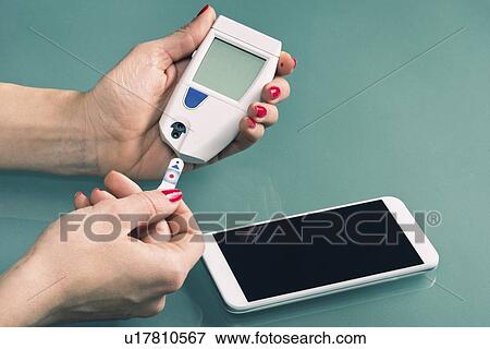 Stock Photo - Blood sugar test. Fotosearch