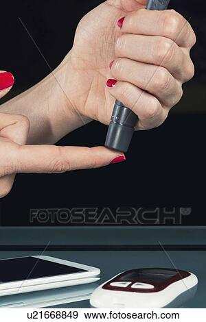 Stock Photo - Blood sugar test. Fotosearch