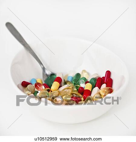 Stock Photo - Bowl of pills. Fotosearch